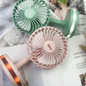 Mini Table Fan pink and green colors with decorative background