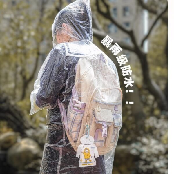 Person wearing clear disposable raincoat covering themselves and a backpack.