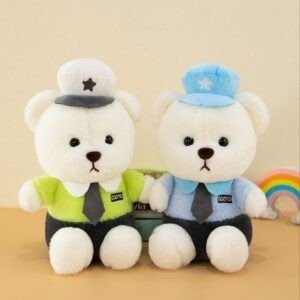 Two identical white teddy bear plush toys, one wearing a blue shirt and blue captain's hat, the other wearing a yellow shirt and white captain's hat, sitting side by side.