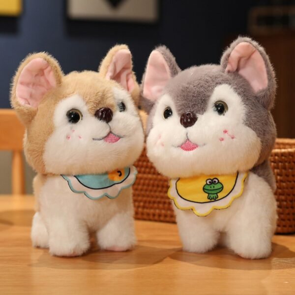 Two adorable husky puppy plush toys sitting side by side on a wooden surface one light brown and one grey, both wearing bibs.