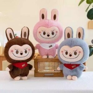 Three adorable plush bunny dolls in monkey costumes; wholesale soft stuffed animal toys in brown, pink and grey for bulk purchase.