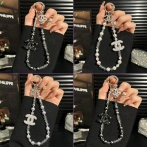 Luxury beaded phone charm strap with faux pearls, crystal beads and a rhinestone-encrusted double-C emblem